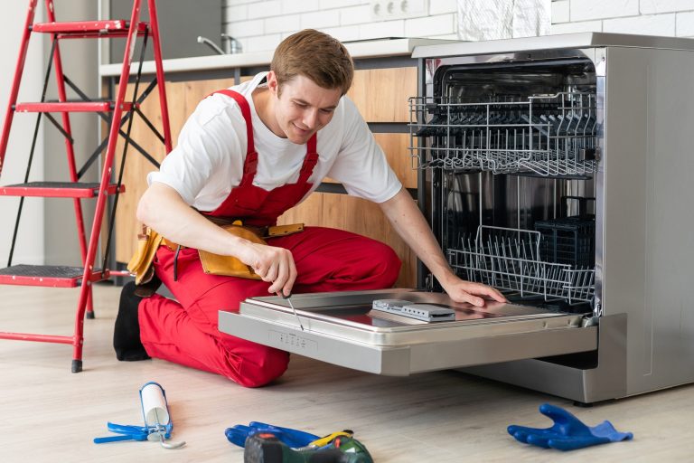 master of maintenance young man providing home appliance repair services