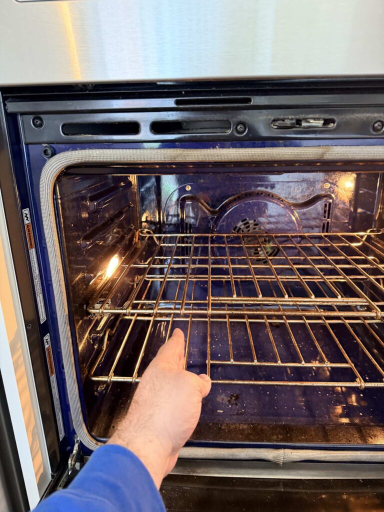 appliance oven repair markham persons hand pulling applianceforever ca