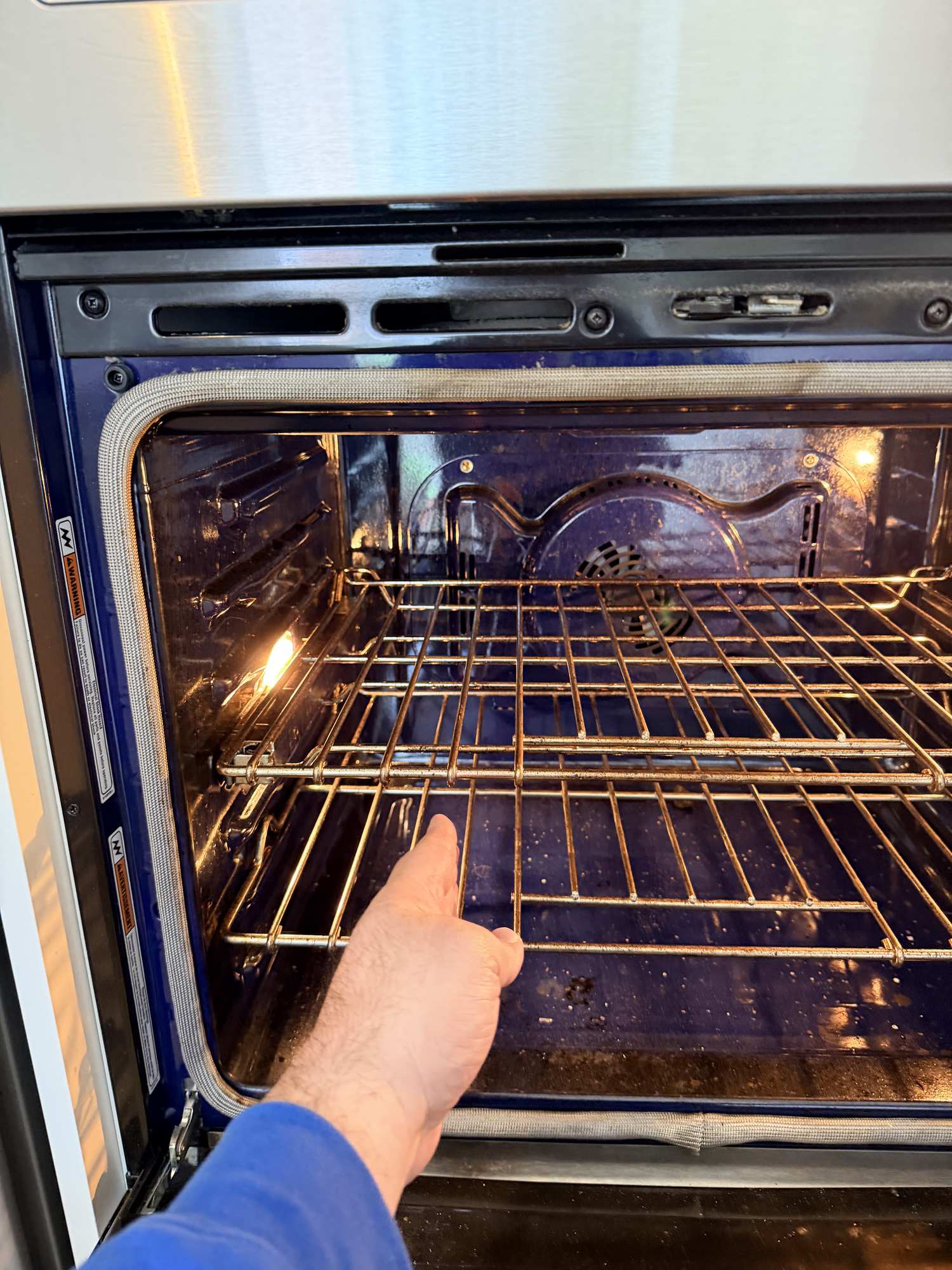 appliance oven repair markham persons hand pulling applianceforever ca