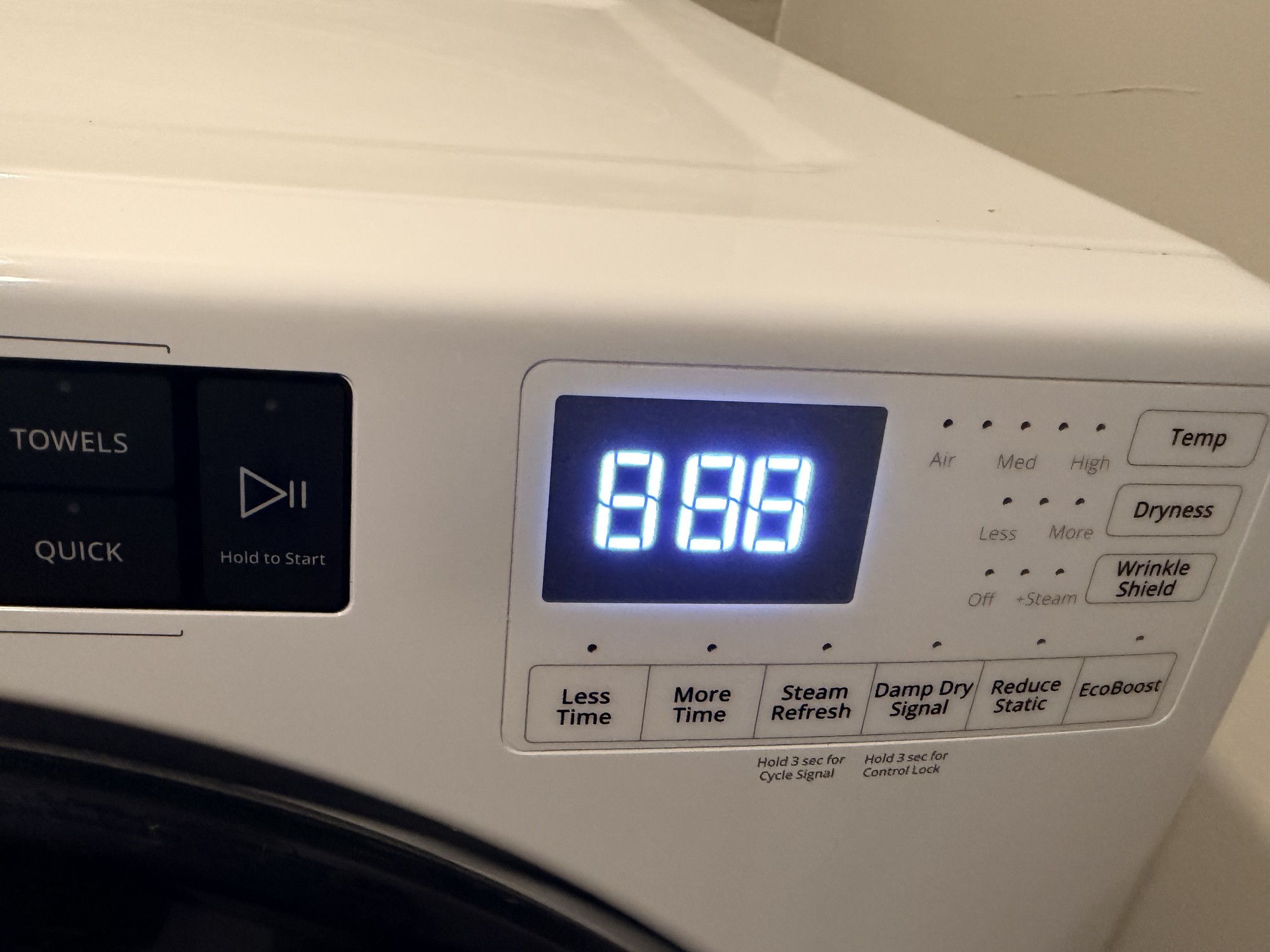 LG washer control panel close-up displaying the LE error code on the digital display