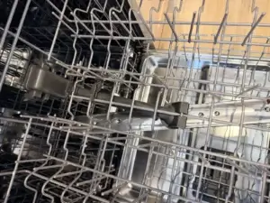 dishwasher repair open dishwasher metal racks spray arm visible appliance foreve
