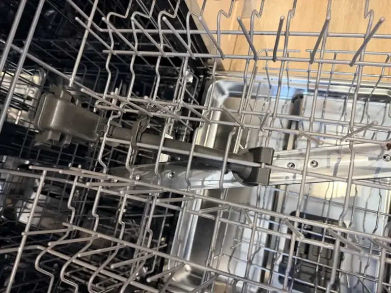 dishwasher repair open dishwasher metal racks spray arm visible appliance foreve