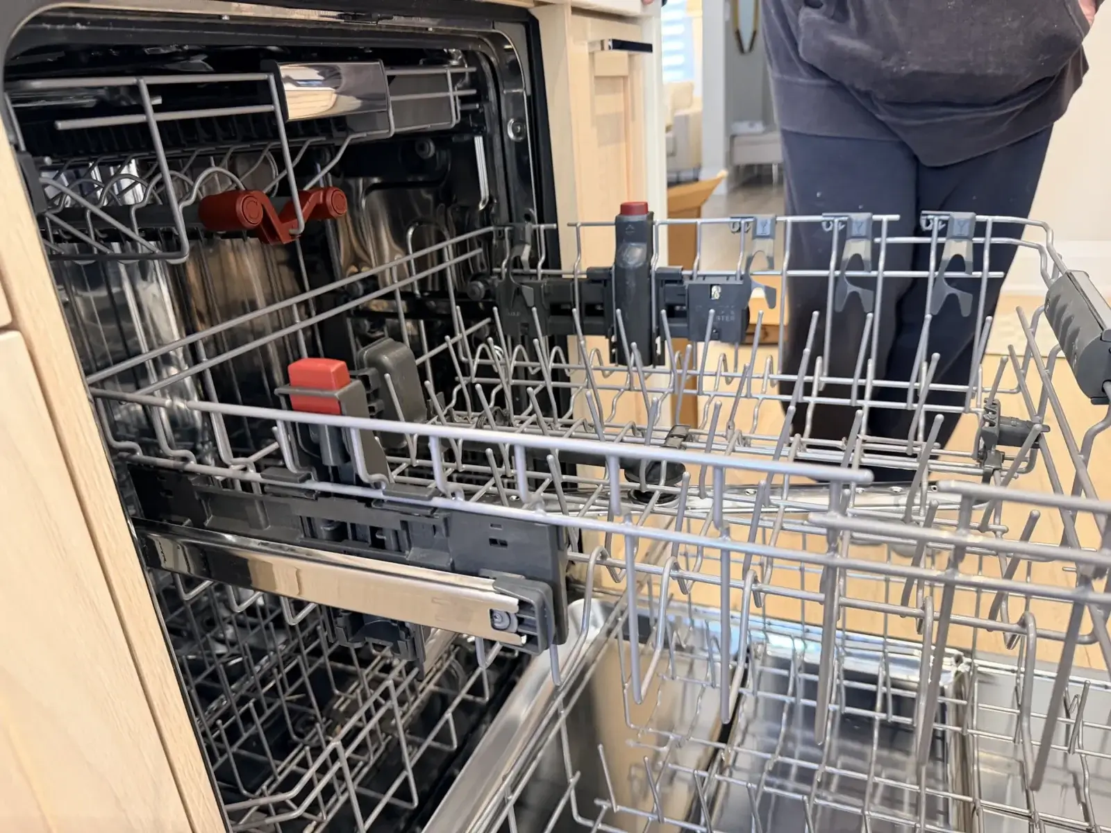 Appliance Forever technician opening a Frigidaire dishwasher for a drain-pump diagnostic in Bradford ON