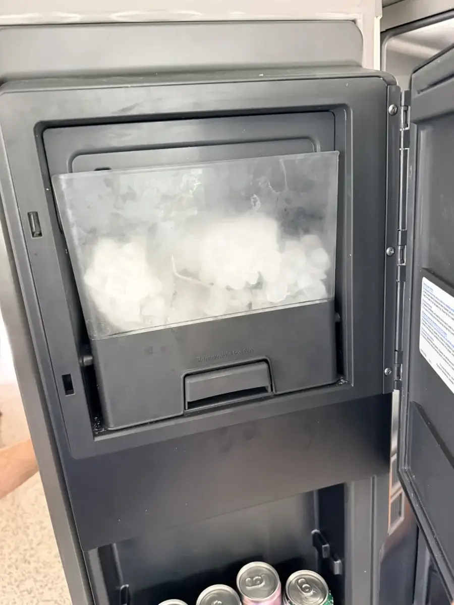 fridge repair ice maker refrigerator filled ice cubes compartment below holding